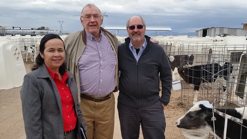 Dr. Drew Vermeire on site with colleagues and calves